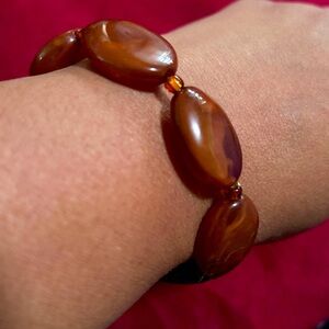 Vintage Brown Yellow Beaded Elastic Bracelet with orange bead spacer.